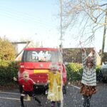 children excitedly watch the coke geyser explode