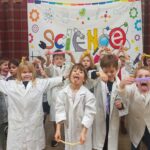 children wearing lab coats and having fun at a Devon Science birthday party