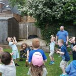 children excitedly watch on as the coke and mentos geyser goes so high!